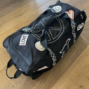 Large Peace Love World rolling duffel bag
